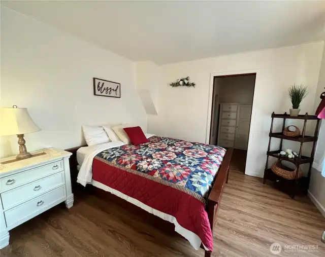Primary bedroom with walk in closet. This bedroom is on main the floor