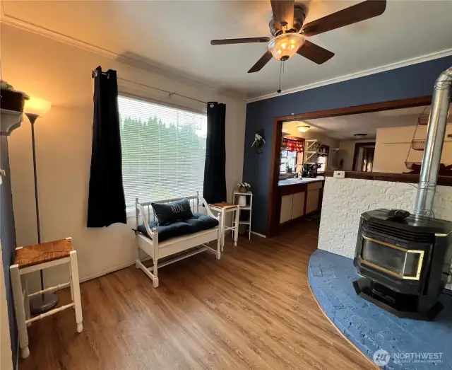 Sitting/extra mingle space leads to the kitchen