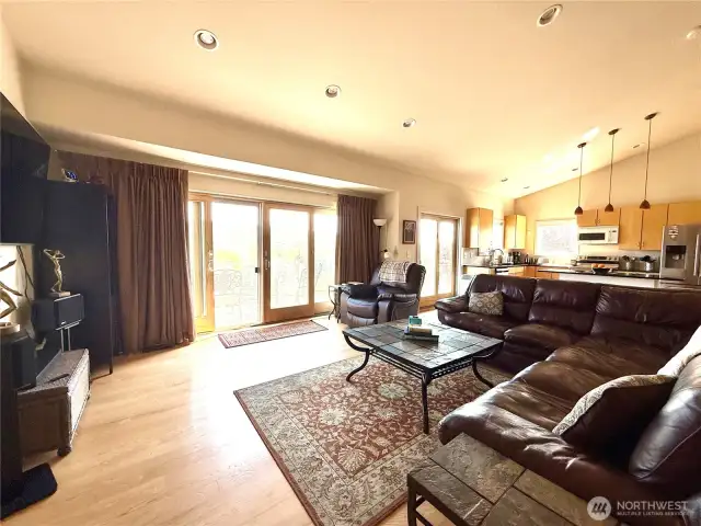 Living Room with Doors Out to the Deck Which Overlooks the River and Golf Course