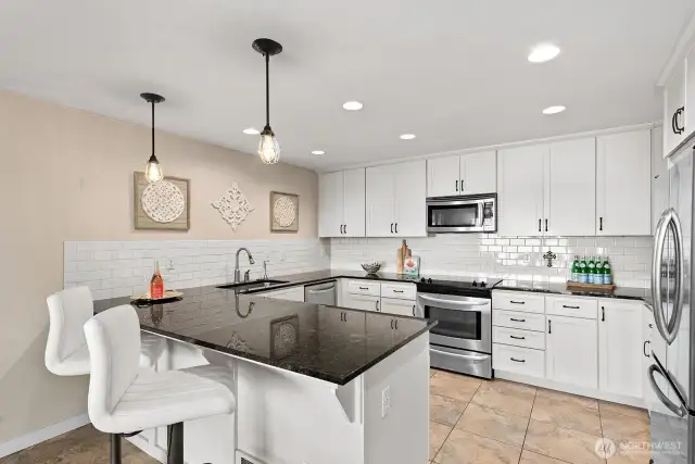 Counter seating adds to the functionality of the kitchen.