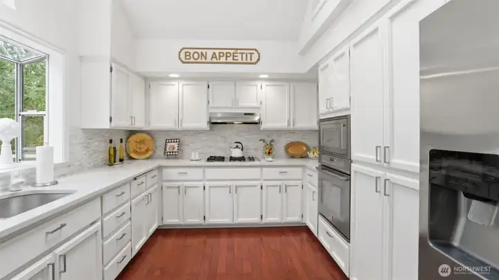 The kitchen has been well designed for storage counter space and plenty of helpers.