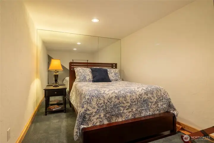 Flexible bonus space featuring a floor-to-ceiling mirror, ideal for workouts, yoga, or an elevated dressing room