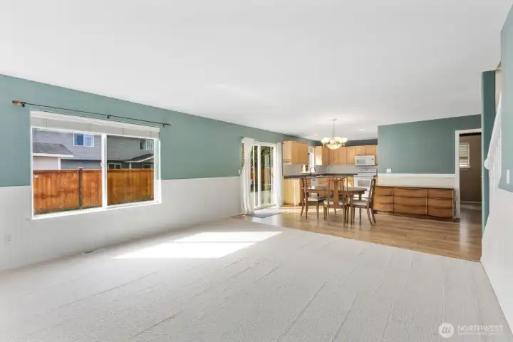 Living room open to dining area and kitchen.
