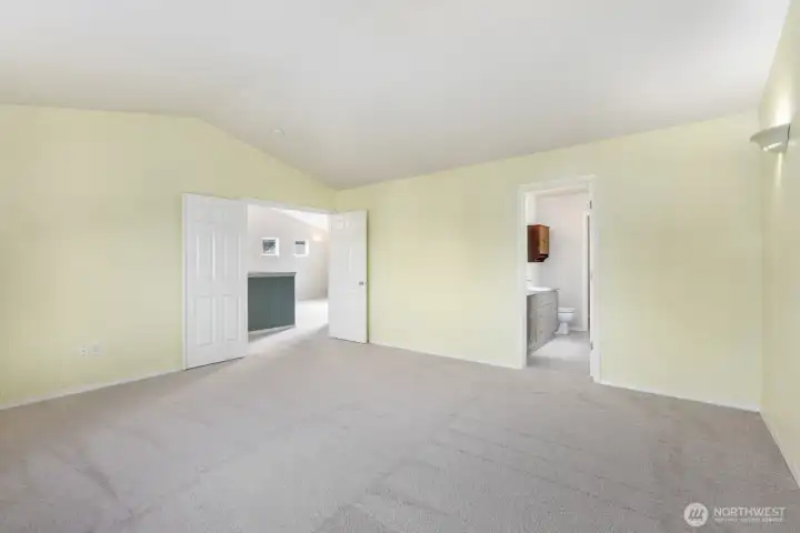 Double doors leading into the spacious primary suite.