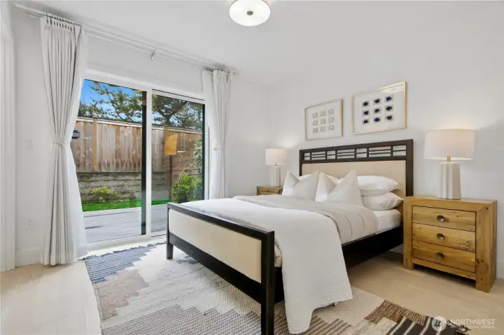 3rd bedroom on the ground floor with ajacant bathroom, and sliding door to the backyard