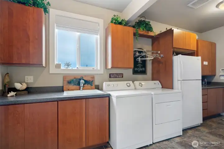 Spacious laundry room and storage space