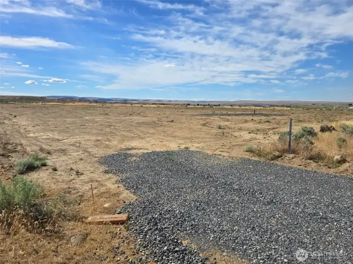 Eng of gravel road at southeast corner of property