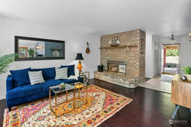 Living room with wood-burning fireplace.