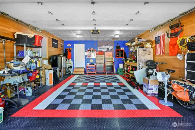 This garage is a mechanic's or craftsman's dream! The floor tiles will remain.