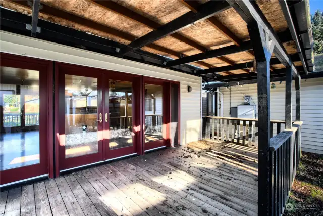 Back porch. Doors lead to the kitchen & great room.