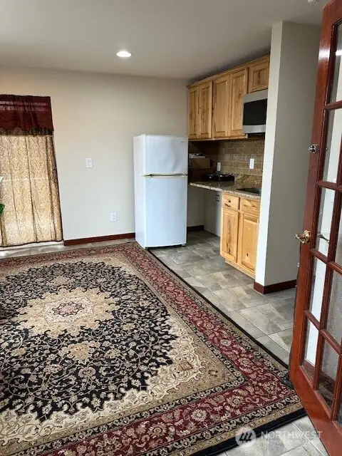 Lock off area includes simple kitchen, living area, full bath and large bedroom with walk in closet. Separate entry door too.