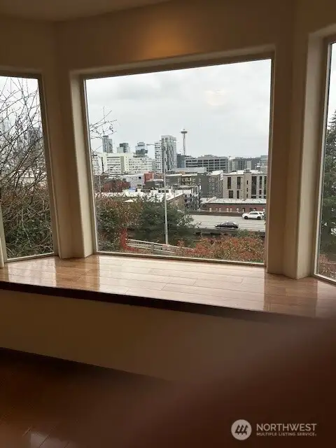 The main level floor bonus room has a fireplace and city view window seat