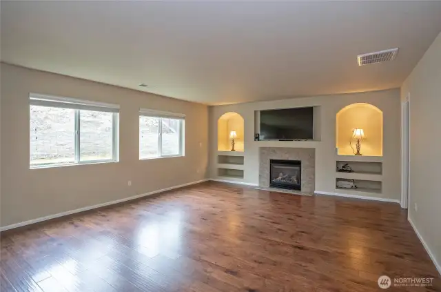 Enjoy natural light and backyard views through two generous windows in the family room, facing the fenced and terraced yard.