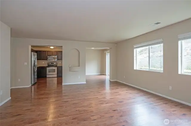 Open view from the family room into the kitchen and dining areas, highlighting the home's seamless flow.