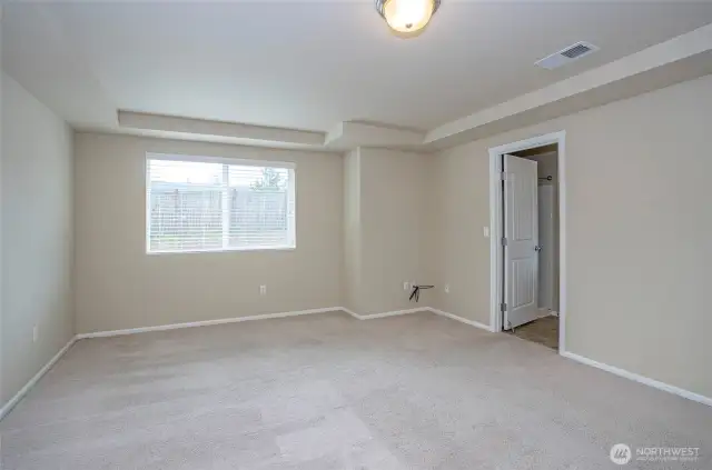 Another angle of the spacious primary suite with direct access to the private 5-piece bath.