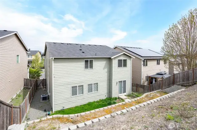Elevated perspective from the top terrace highlights the yard’s untapped potential.