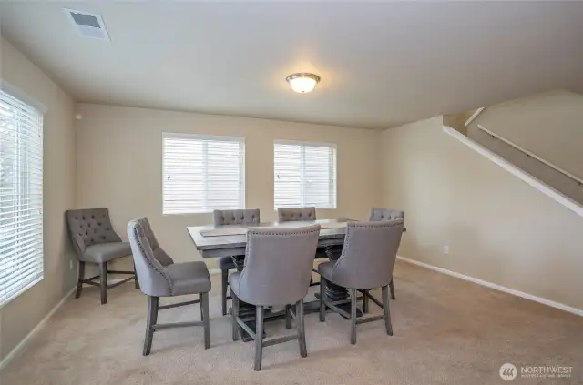 This view captures the living space from the entryway, showcasing its open feel.