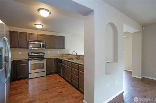 The kitchen is perfectly positioned within view from the family room, enhancing the open-concept feel.