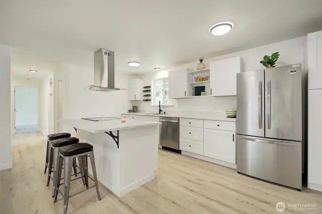 Wonderful kitchen layout with breakfast bar and new SS appliances.