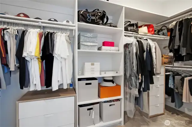 Large walk-in closet with built-ins.