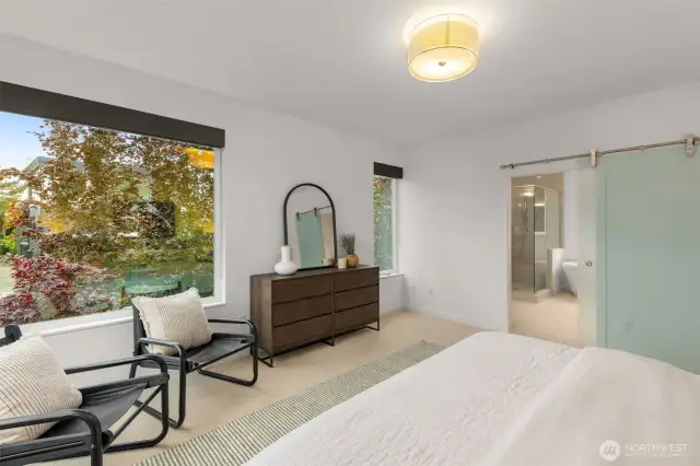 Primary suite with new carpet, fresh paint, spa-inspired bathroom, and walk-in closet.