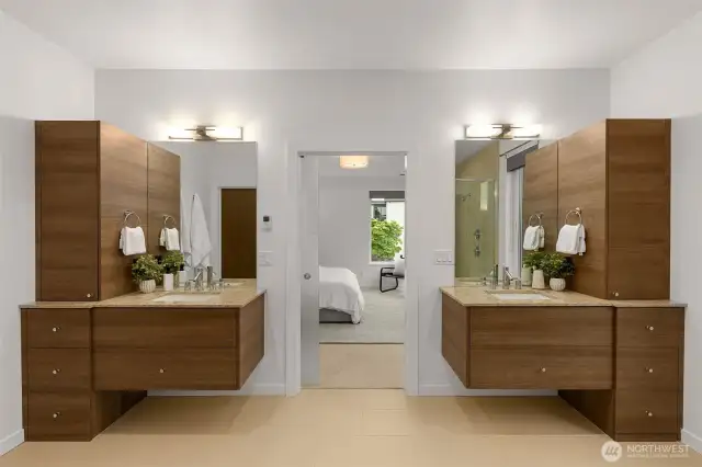 Spa-inspired bathroom with soaking tub, spacious shower, and separate sink stations.