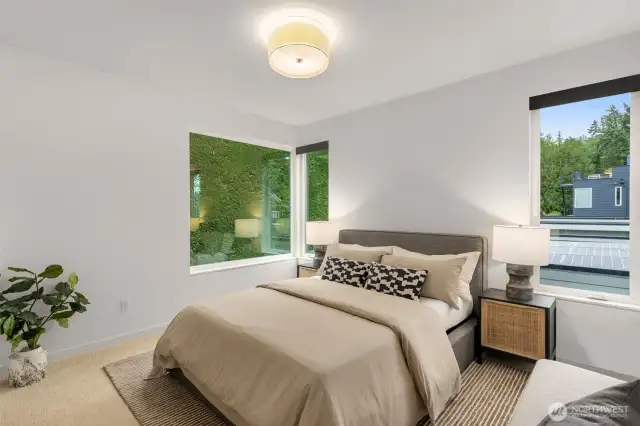 Spacious bedroom with new carpet and fresh paint.