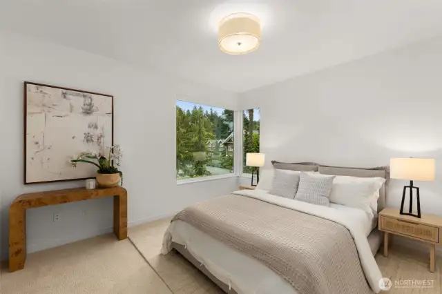 Spacious bedroom with new carpet and fresh paint.