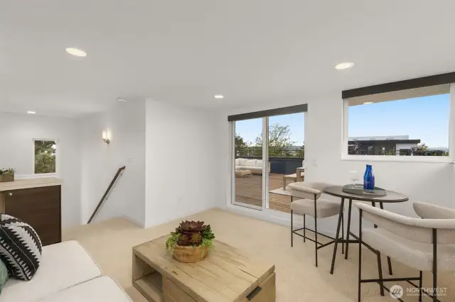 3Rd floor loft with expansive entertainment sized view deck. Enjoy sweeping views of the Puget Sound, Olympic Mountains, and sunsets.