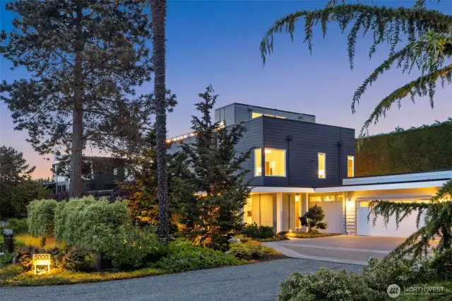 Every detail reflects quality innovation, including exquisite landscaping, solar panel power, Built Green certification, and 3-car garage with EV charger. True modern sanctuary.