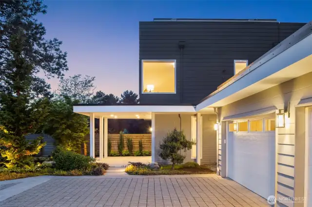 Paver driveway, 3-car garage, covered front door patio, and freshly painted exterior.
