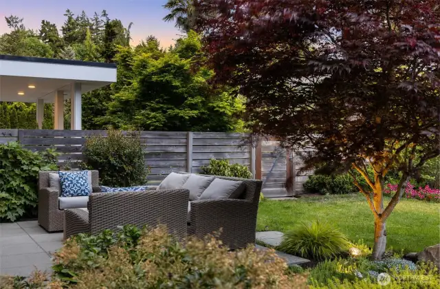 Exquisite landscaping in front and back and wide designer style paver walkways in front and back.