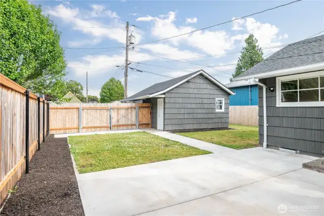 New fence, gates, patio and sidewalk