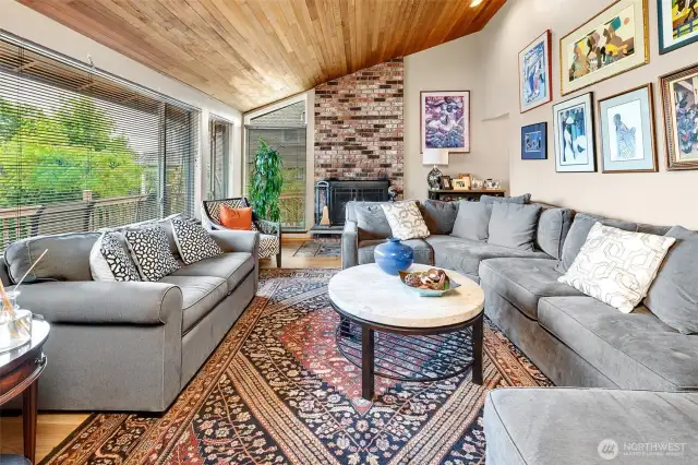 Dynamic combination of hardwood floors, tongue and groove vaulted ceilings, and floor to ceiling windows all work together to create vibrant light-filled living spaces.