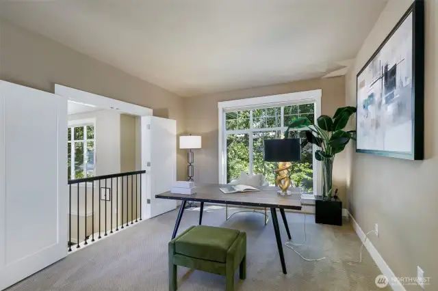 Open office with double door/balcony to the entry way