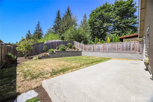 Poured concrete patio is easy maintenance on a level backyard