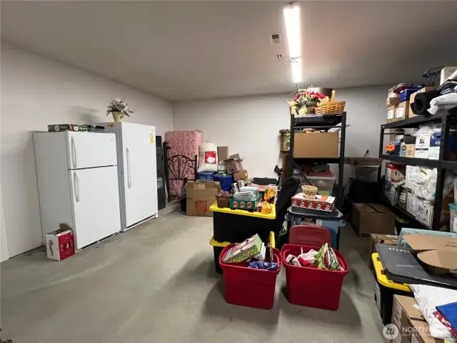 Huge storage room downstairs or bonus rec room. This room leads to the 4-car attached garage. Utility room with water heater, salt-free hard water conditioner, whole house surge protector, WfFi thermostats, General whole house generator with 500-gallon gas tank.