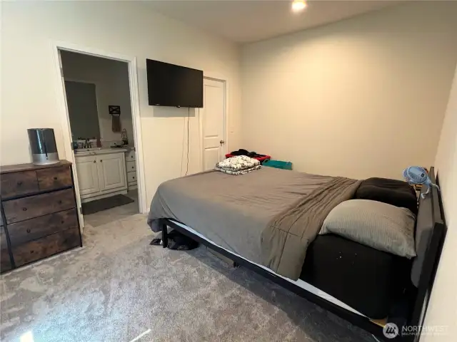 Primary bedroom with attached bathroom. On the opposite side of the home from the other bedrooms. Large deep closet.