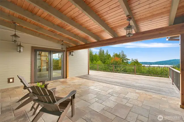 Wrap around teak deck, Wood burning Covered outdoor travertine deck with views adds for extra living space. fireplace outside on the upper level deck off of the dining room