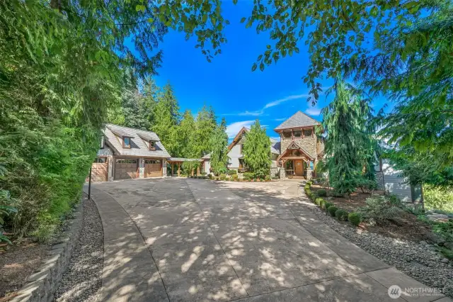 Stamped driveway, shingle roof, & copper gutters