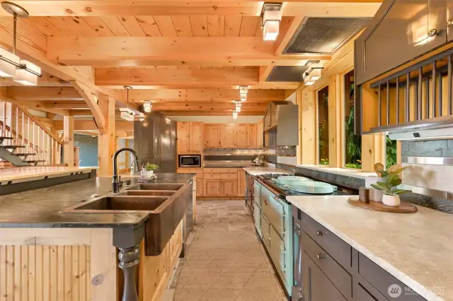 Copper kitchen sink, custom notty pine cabinets