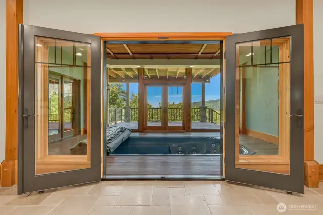 Covered indoor swim spa with view of the yard