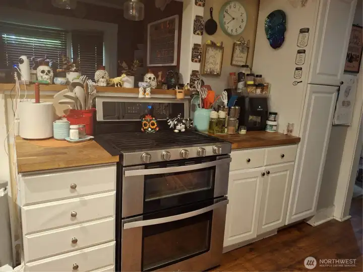 Kitchen stove area and more cabinets!Main house