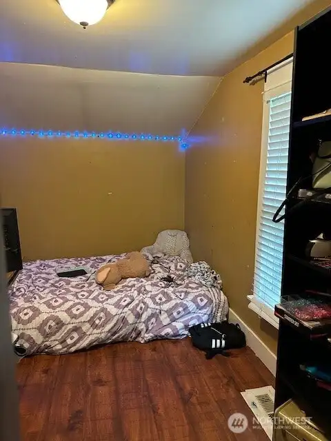 Bedroom or office off the dining room on the main floor.  Extra room