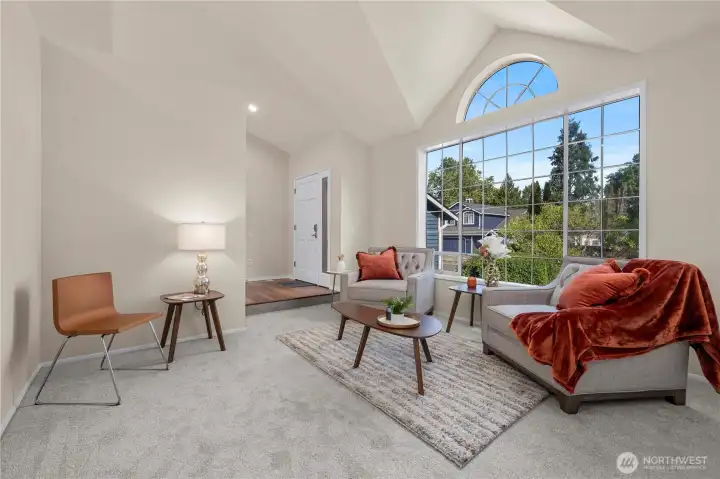 Living room hosts vaulted ceilings