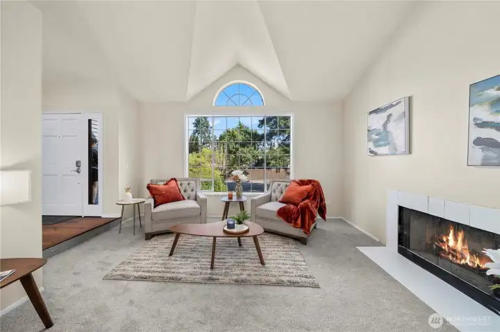 Sit and relax by the living room wood fireplace