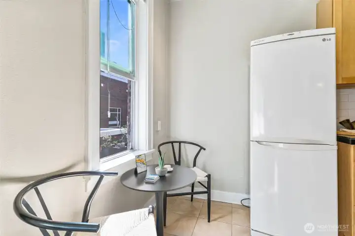 Bright kitchen with charming eating nook, vintage touches, and modern updates for everyday functionality.