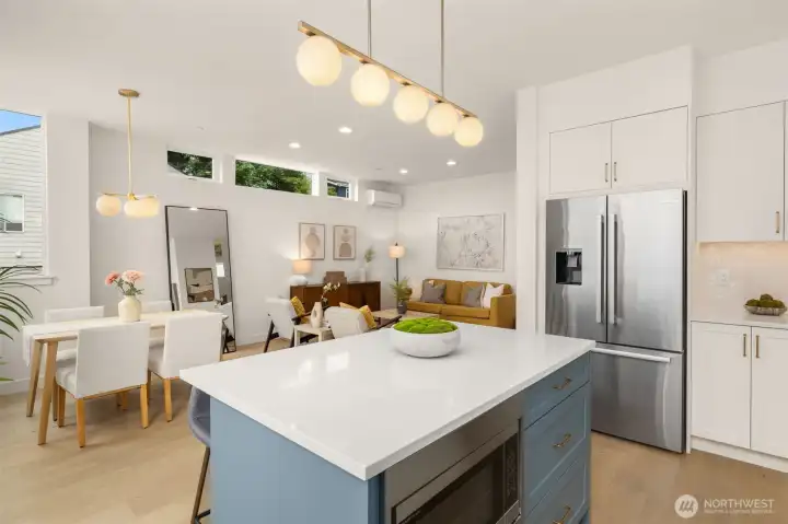 Connected, is a massive great room, connecting the living dining & kitchen space creating a natural gathering place in the home.