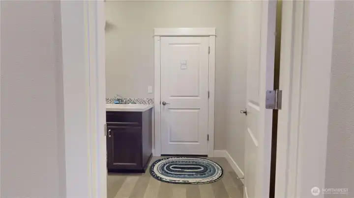 Looking into utility room and garage entrance