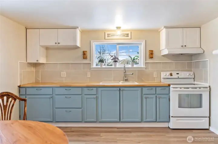 Butcher block countertops, tile backsplash